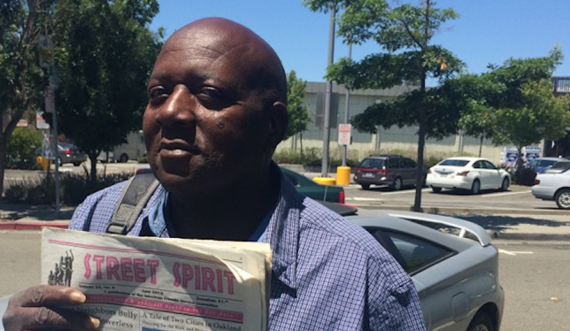 Alando Marcell Williams displays the June issue of Street Spirit. Photo 2016 KALW/Mary Rees