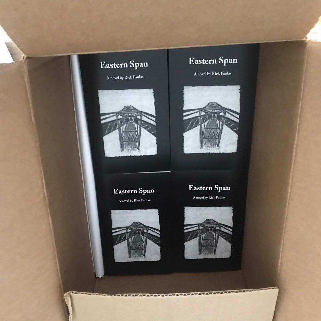 Eastern Span books arriving in a cardboard box