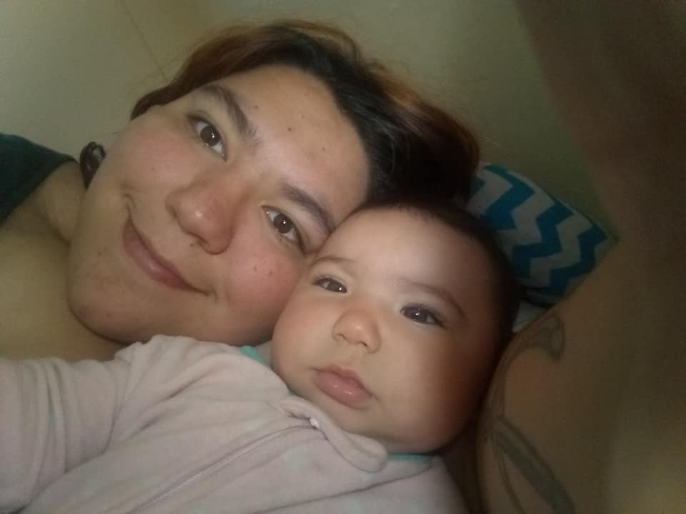 Author Meghan "Roadkill" Johnson with her baby staying in a homeless shelter.