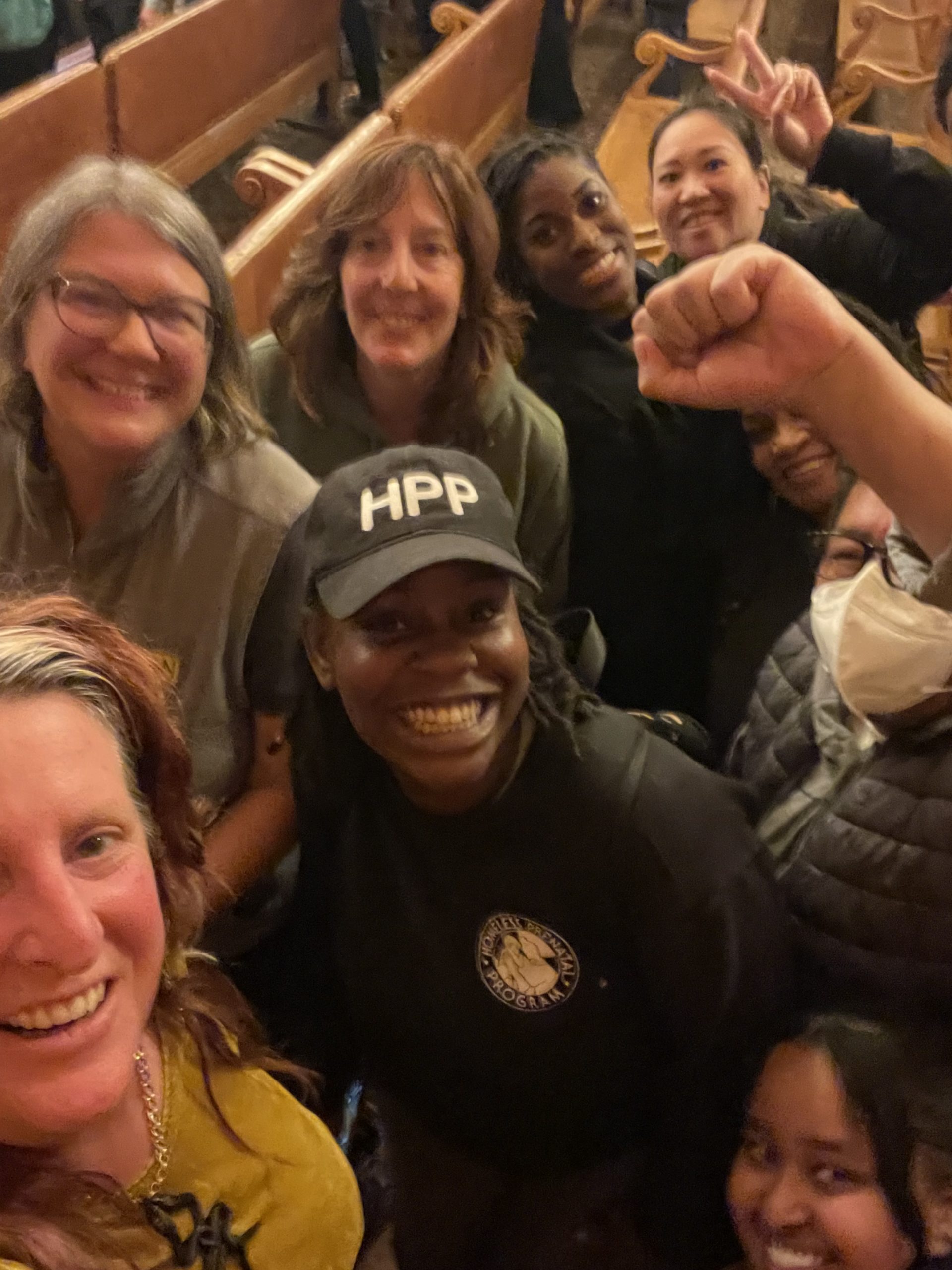 Members of the Budget Justice Coalition inside Board of Supervisors chamber at SF City Hall