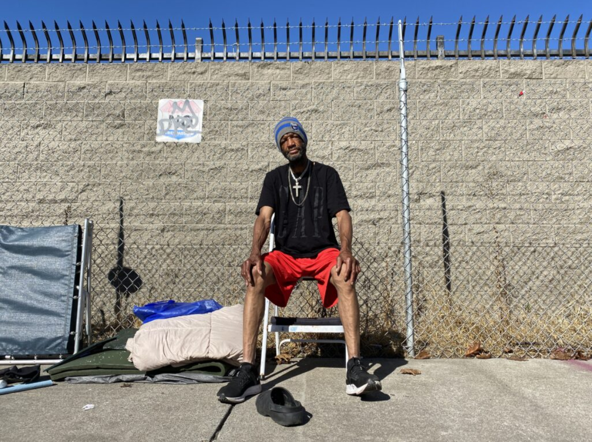 Clarence Galtney, 65, takes a break from organizing his belongings on Harrison Street, November 8, 2023.